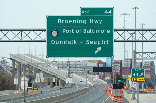 A container ship as it rests against wreckage of the Francis Scott Key Bridge on Tuesday, March 26, 2024, as seen from Dundalk, Md. 