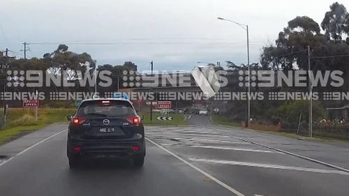 New dash-cam video has shown the moment the truck lost control and smashed into the barrier, before its load went flying.