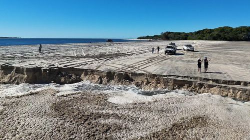 A sinkhole has opened up at Inskip Point north of Rainbow Beach in Queensland. 
