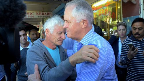 Prime Minister Malcolm Turnbull embraces father of MH17 victim