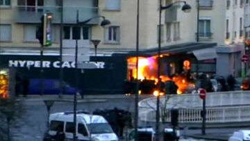 An explosion goes off at the kosher deli in Paris during the police operation. (Supplied)