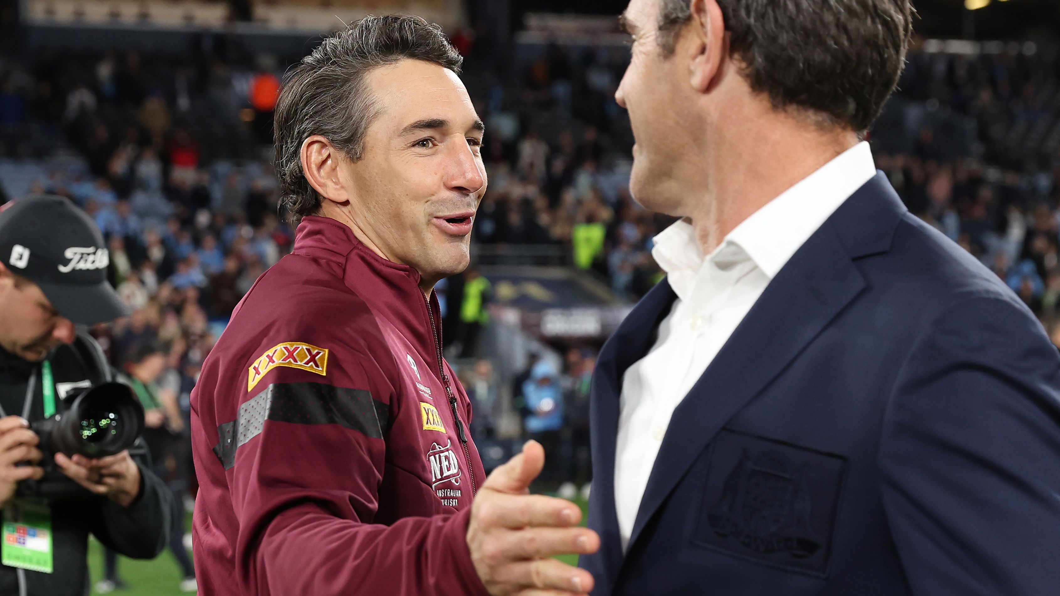 Maroons coach Billy Slater and Blues coach Brad Fittler embrace after game three of the State of Origin series.