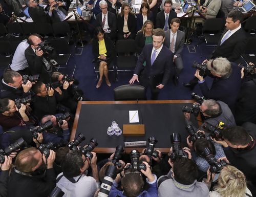 A packed media scrum have watched Zuckerberg testify in Congress, (AAP)
