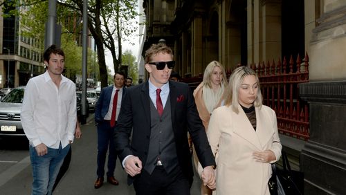 Richard Vincec (centre) arrives to his plea hearing at the Supreme Court in Melbourne.