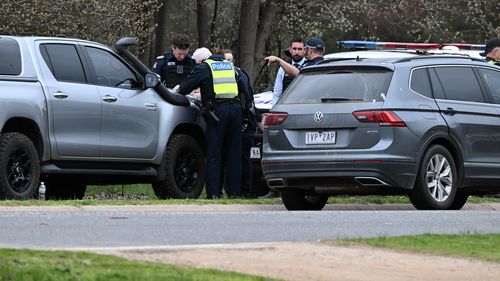 Police at the scene in Porepunkah, where two officers were shot dead and another injured while serving a warrant.