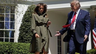 President Donald Trump and first lady Melania Trump arrive for a tree planting ceremony to celebrate Earth Day, on the South Lawn of the White House, Wednesday, April 22, 2020, in Washington