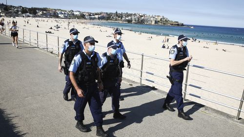 Police check people at Bondi Beach. Sydney