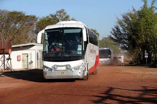 The delegates from Canberra arrive at the farm by bus. Picture: AAP