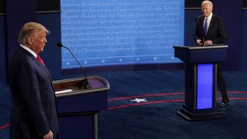 President Donald Trump and Democratic presidential candidate former Vice President Joe Biden walk on stage during the second and final presidential debate Thursday, Oct. 22, 2020, at Belmont University in Nashville, Tenn. (AP Photo/Morry Gash, Pool)