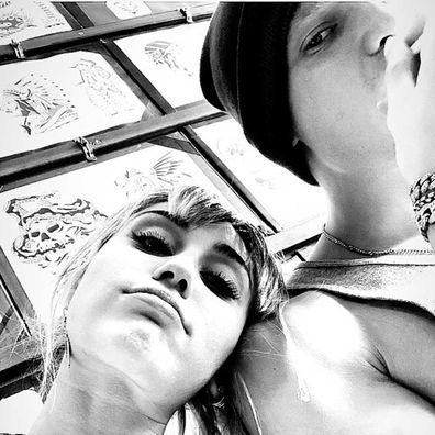 Cody Simpson and Miley Cyrus getting matching tattoos.