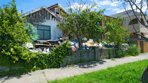 An image of the dilapidated home from Raine &amp; Horne's website.