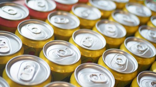 A row of soft drink cans.