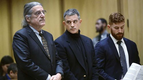 Fotis Dulos (centre) is accused of killing his estranged wife.