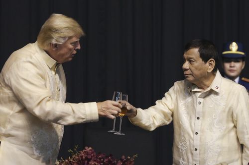 Donald Trump and Rodrigo Duterte at a gala dinner marking ASEAN's 50th anniversary. (AAP)