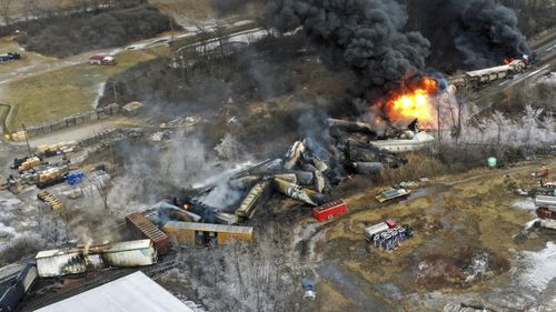 This photo taken with a drone shows portions of a Norfolk and Southern freight train that derailed Friday night in East Palestine, Ohio are still on fire at mid-day Saturday, Feb. 4, 2023. 