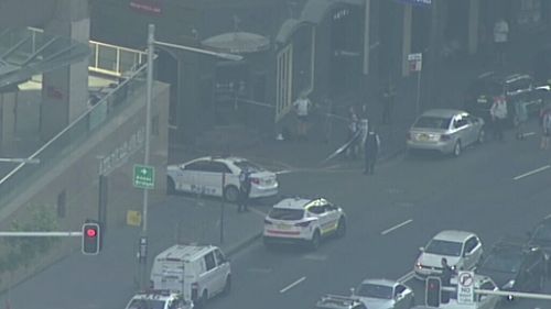Marked police cars near the building. (9NEWS)
