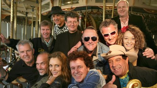 Gudinski with his acts for The Countdown Spectacular  launch at Luna Park; Darryl Braithwaite, Joe Camilleri, Totti Goldsmith, Leo Sayer, Ian Molly Meldrum, Eve Von Bibra, Ross Wilson, Wilbur Wilde, Red Symons, Joe Dolce and Harvey James.