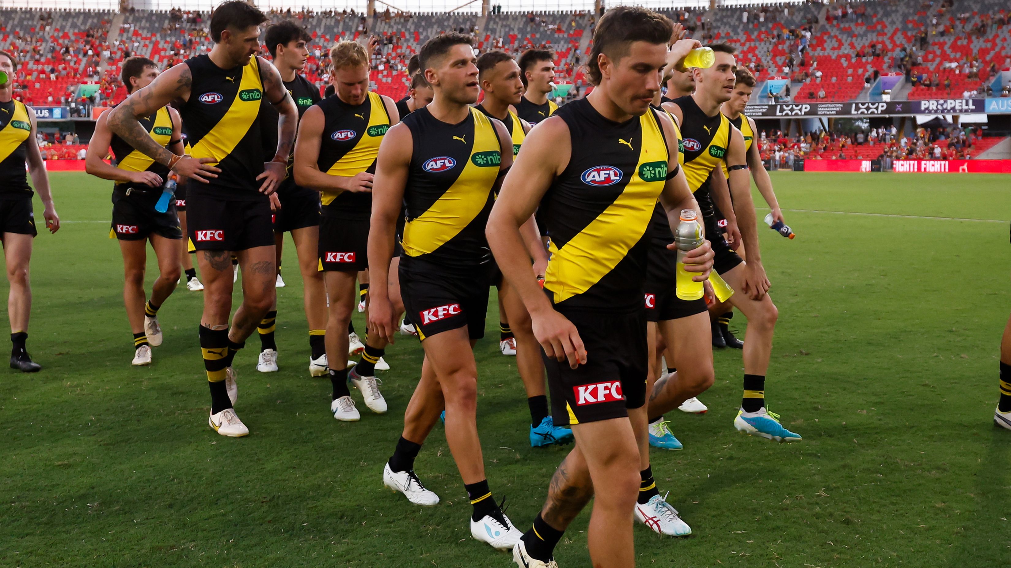 The Tigers leave the field after a loss during the 2024 AFL Opening Round match between the Gold Coast SUNS and the Richmond Tigers at People First Stadium on March 09, 2024 in Gold Coast, Australia. (Photo by Dylan Burns/AFL Photos via Getty Images)