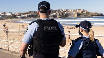Police patrol Bondi Beach during Sydney&#x27;s latest COVID-19 lockdown.