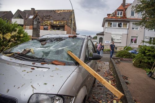 A damaged car is seen after a storm in Paderborn, Germany, Friday, May 20, 2022.  