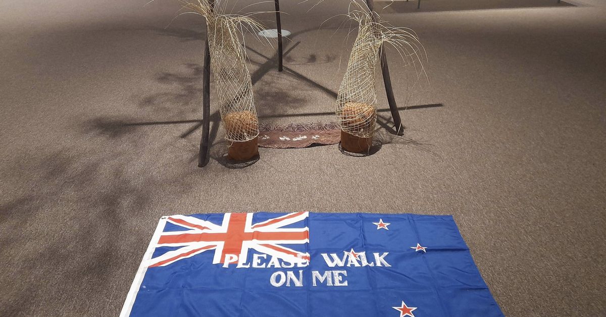 Controversial flag invited art gallery visitors to 'please walk on me'. It lasted 19 days