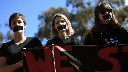 Students participate in a protest after the release of the national student survey on sexual assault and sexual harassment. (AAP)