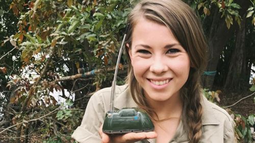 Bindi Irwin holds a satellite tracker used to monitor the crocodiles. (Instagram / @bindisueirwin)