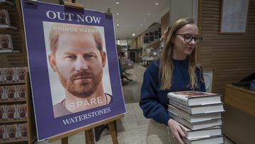 A member of staff places the copies of the new book by Prince Harry called &quot;Spare&quot; at a book store in London, Tuesday, Jan. 10, 2023.  