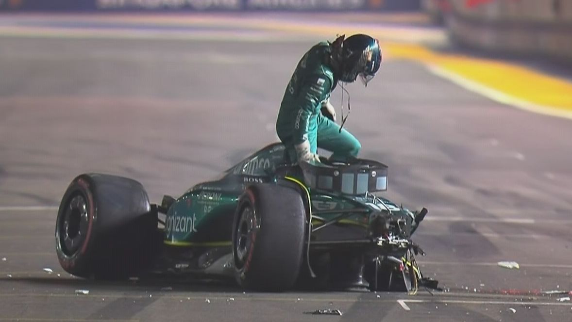 Lance Stroll climbing from what&#x27;s left of his Aston Martin after a massive crash at the end of the first part of qualifying for the Singapore Grand Prix.