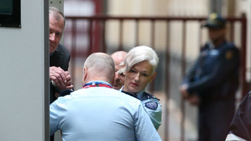 Gregory Keith Davies arrives in a prison van at the Melbourne Supreme Court earlier this year. 