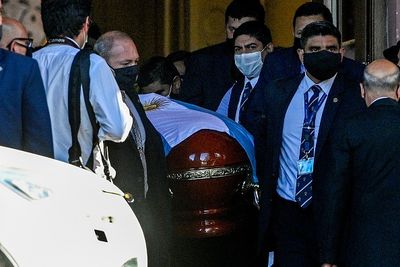 Maradona's coffin carried from his funeral
