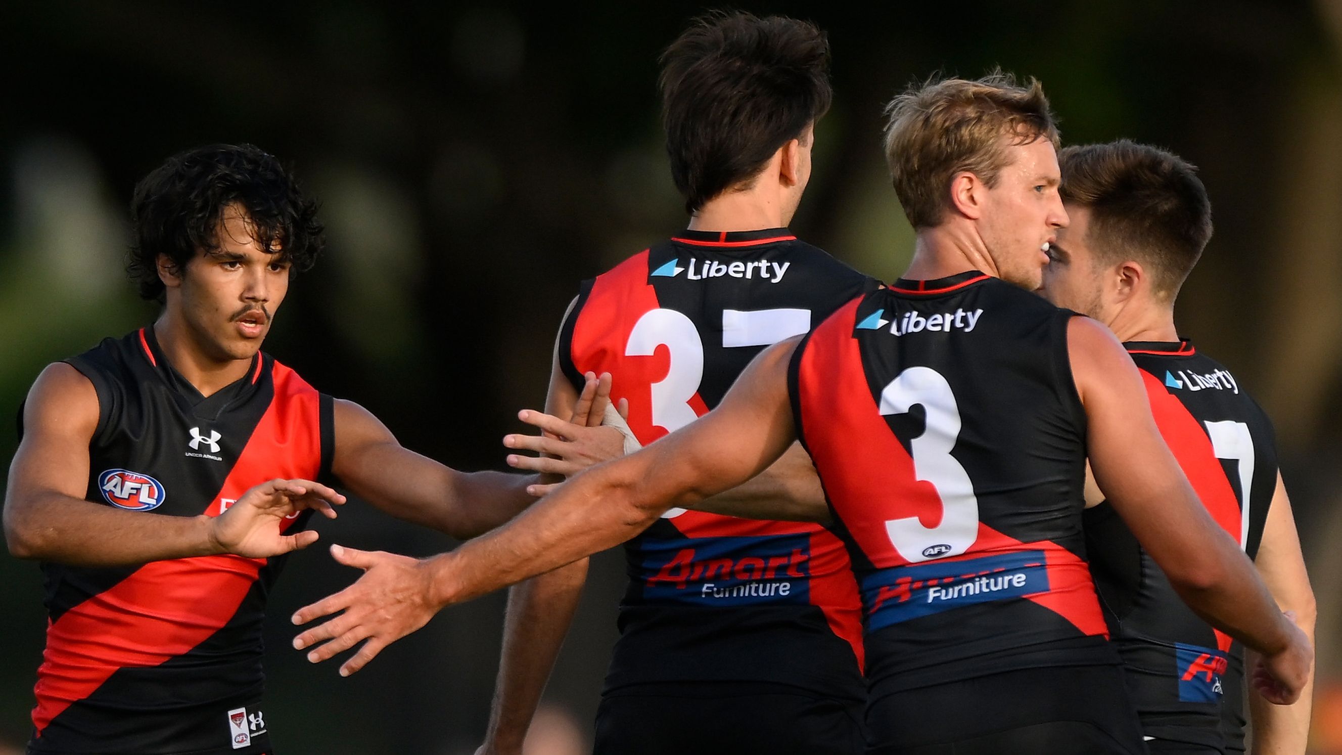 GOLD COAST, AUSTRALIA - FEBRUARY 23: Alwyn Davey of the Saints celebrates kicking a goal with team mates during the AFL match simulation between Gold Coast Suns and Essendon Bombers at Austworld Centre Oval on February 23, 2023 in Gold Coast, Australia. (Photo by Matt Roberts/Getty Images)