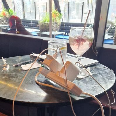 A customer at a pub has received backlash after charging three devices at once via an extension cord.