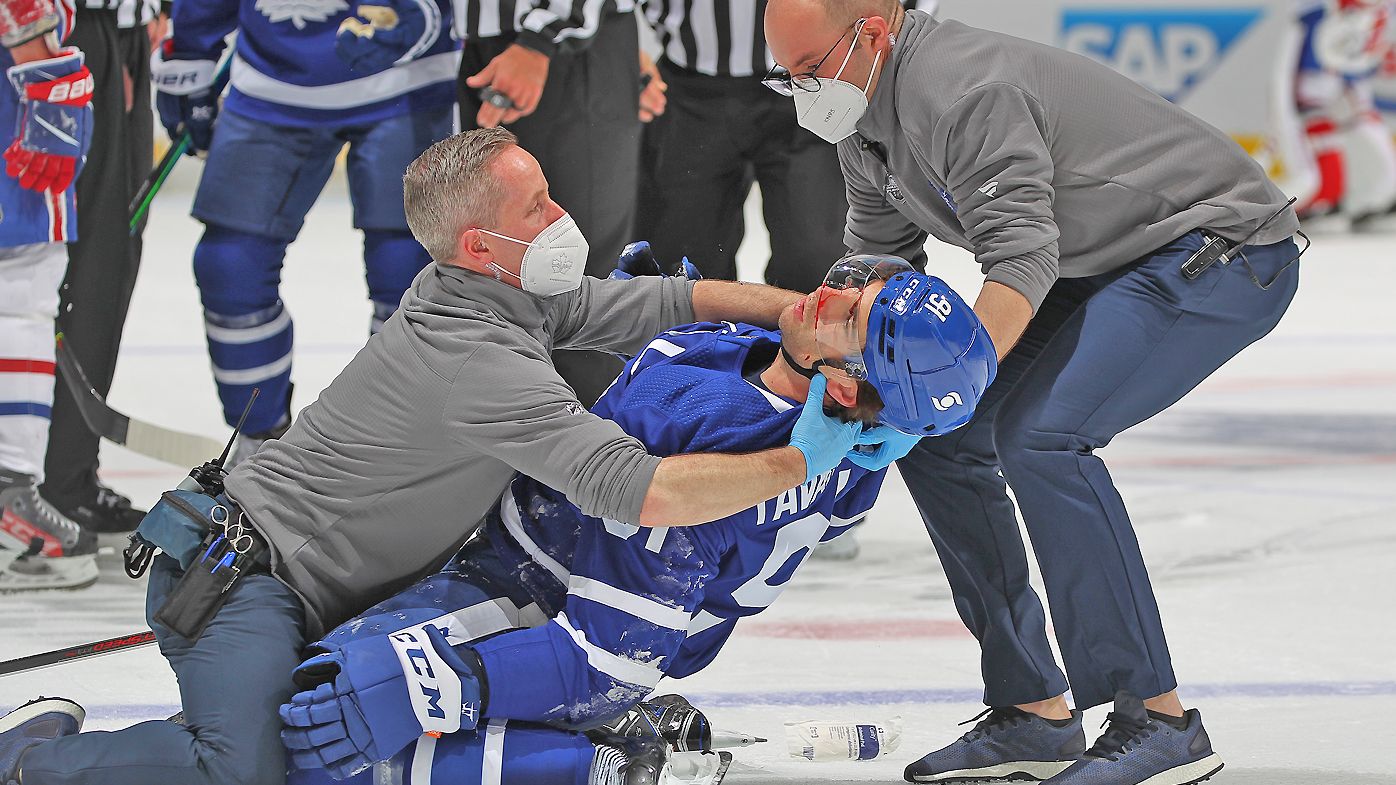 John Tavares #91 of the Toronto Maple Leafs is injured against the Montreal Canadiens 