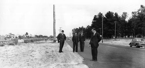 Serial killer Eric Edgar Cooke, second from left, is pictured with WA Police at the crime scene of murder he later confessed to.