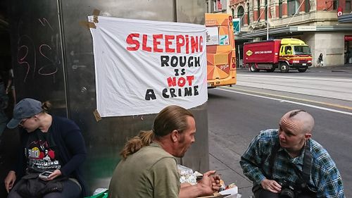 Protesters at a homeless camp outside Flinders Street station before it was cleared out. (AAP)