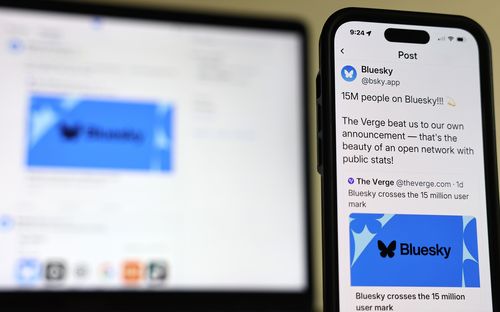 PASADENA, CALIFORNIA - NOVEMBER 14: In this photo illustration, the Bluesky app is shown on a mobile phone and a computer monitor on November 14, 2024 in Pasadena, California. Social networking app Bluesky has grown by 1.25 million users since the US presidential election as some people ditch rival X, which is owned by Elon Musk. (Photo illustration by Mario Tama/Getty Images)
