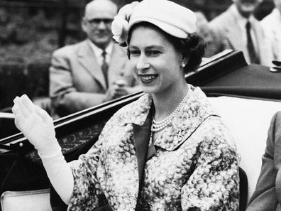 Queen Elizabeth on the way to the races in June 1957. 