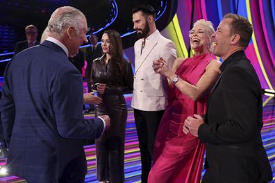 King Charles III, left, and Camilla, the Queen Consort, meet the presenters of this year's Eurovision Song Contest, from right; Scott Mills, Hannah Waddingham, Rylan Clark and Julia Sanina, as they visit the host venue of this year's Eurovision Song Contest, the M&S Bank Arena in Liverpool, England, Wednesday, April 26, 2023.