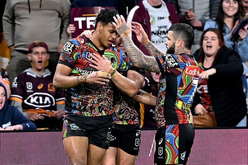 Selwyn Cobbo of the Broncos is congratulated by team mates after scoring a try during the round 22 NRL match between the Brisbane Broncos and the Newcastle Knights at Suncorp Stadium, on August 13, 2022, in Brisbane, Australia. (Photo by Bradley Kanaris/Getty Images)