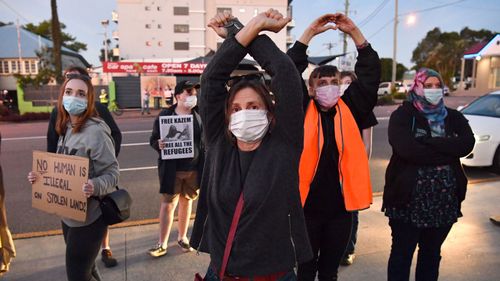 Protestors are seen outside the Kangaroo Point Central Hotel in Brisbane, Friday, June 12, 2020.