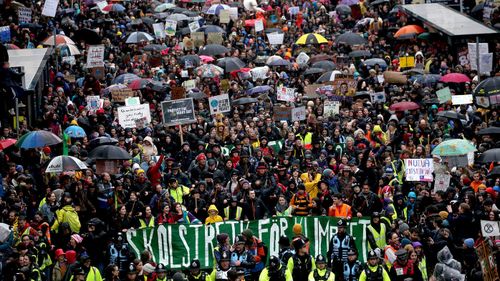 A general view as Greta Thunberg (bottom, yellow coat) takes part the Bristol Youth Strike 4 Climate protest at College Green in Bristol.