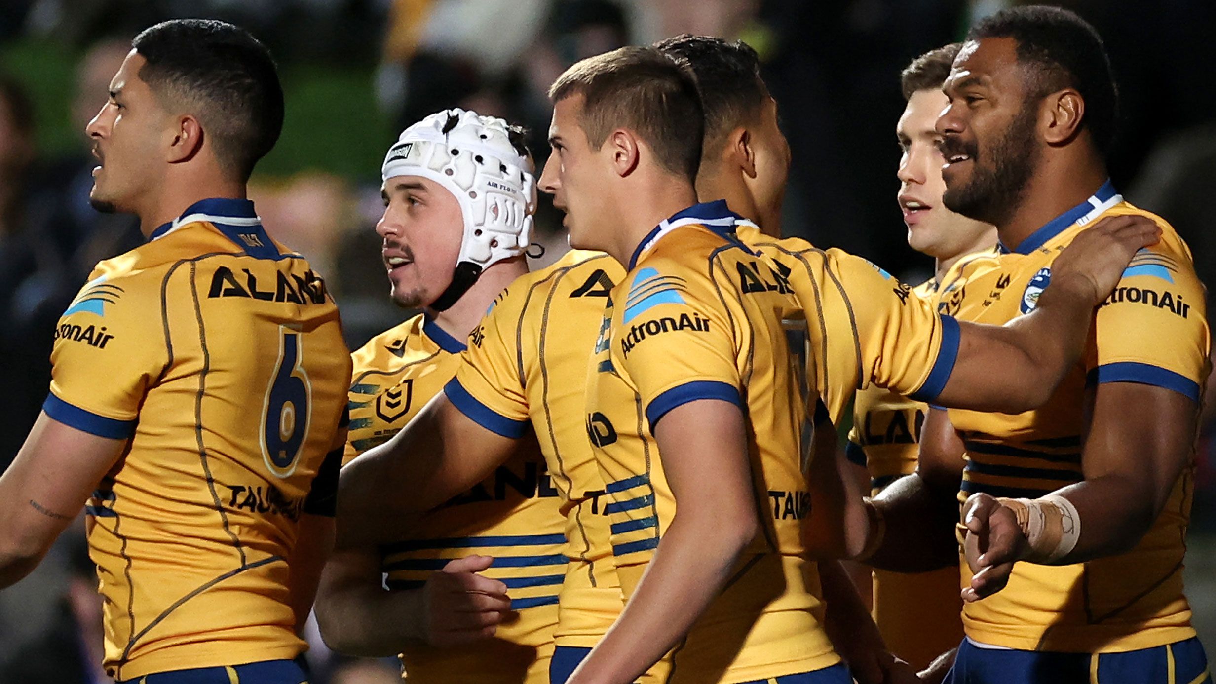 Maika Sivo of the Eels celebrates with teammates after scoring a try against the Manly Sea Eagles.