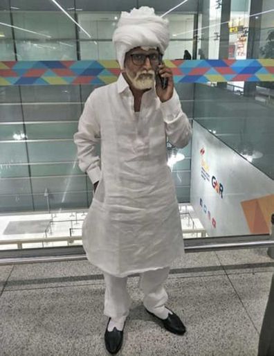A 32-year-old man was detained at New Delhi's Indira Gandhi International Airport for carrying a fake passport while posing as a man more than 50 years his senior.