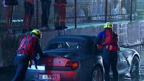 Fire crews rescued the couple from the car stranded in Melbourne's west. (9NEWS)