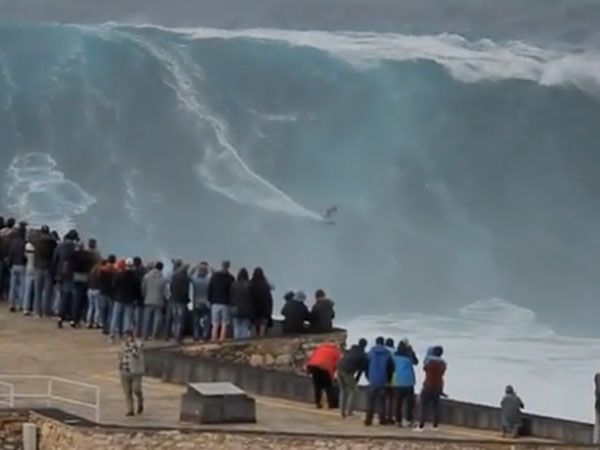 German daredevil Sebastian Steudtner rides a 60 foot wave in Portugal. (Supplied)