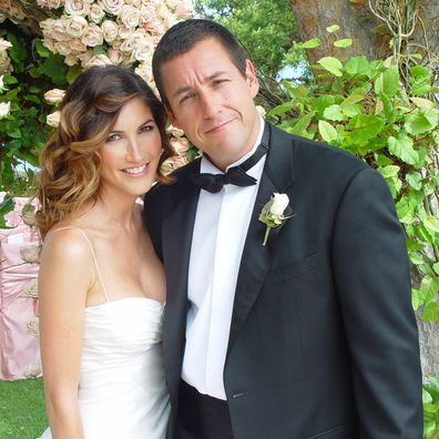 Adam Sandler poses with his bride model-actress Jackie Titone at their wedding June 22, 2003 in Malibu, California. 