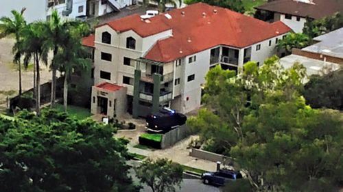 An armoured police vehicle seen at the block of units where a man has been surrounded. (Jake McCallum/Supplied)