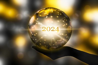 fortunetelling 2024 with a crystal ball in a hand, festive atmosphere for happy new year party or award ceremony or other celebrations, 3d illustration