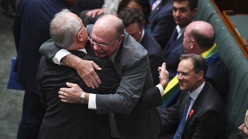 Veteran Liberal MP Warren Entsch hugs the prime minister. (AAP)